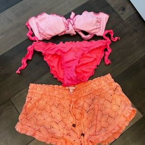 Pink bathing suit with orange cover up shorts